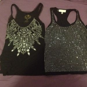Three black tank tops.