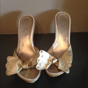 Beautiful gold wedge shoes.