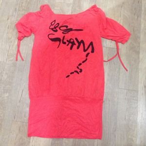 Orange tunic shirt🎀Back has a cut out and a bow