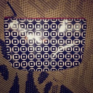 Small black white and red Clinique make up holder