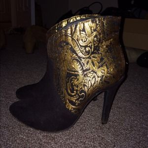 Gold and black heels.