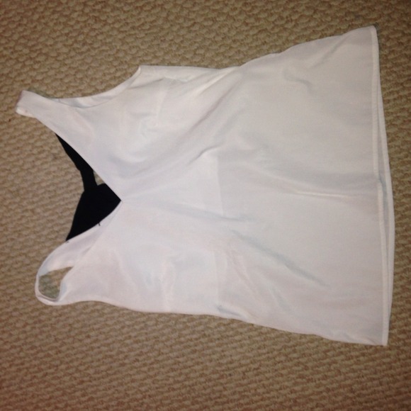 White tank with black bow in the back