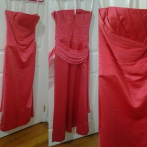 A coral guava color bridesmaid dress