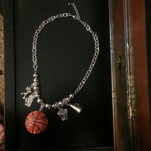 Beautiful bling basketball necklace with charms.
