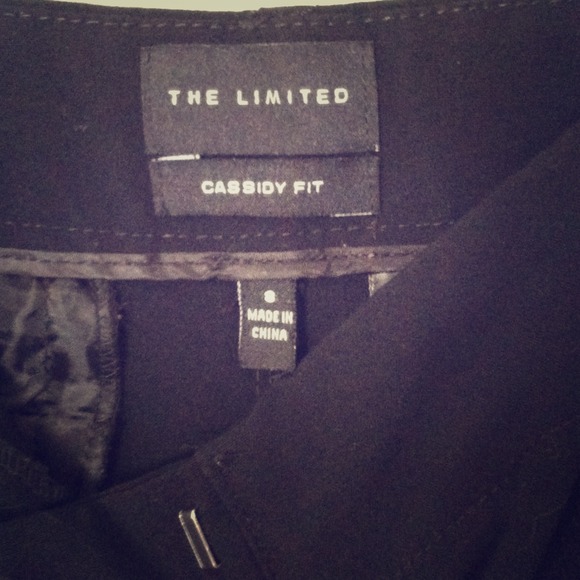 Long black slacks, or work pants