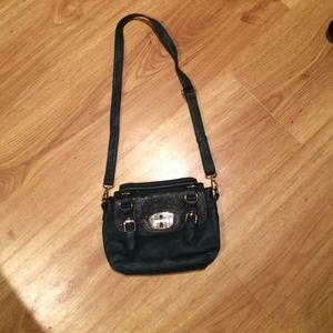 Teal crossbody purse with gold plating.
