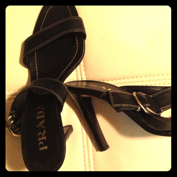 Prada high heeled shoes with strap.