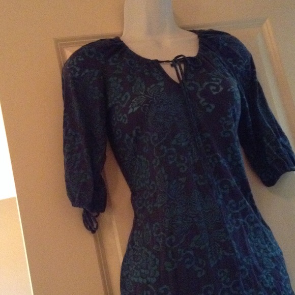 Dark/light blue top with a floral design.