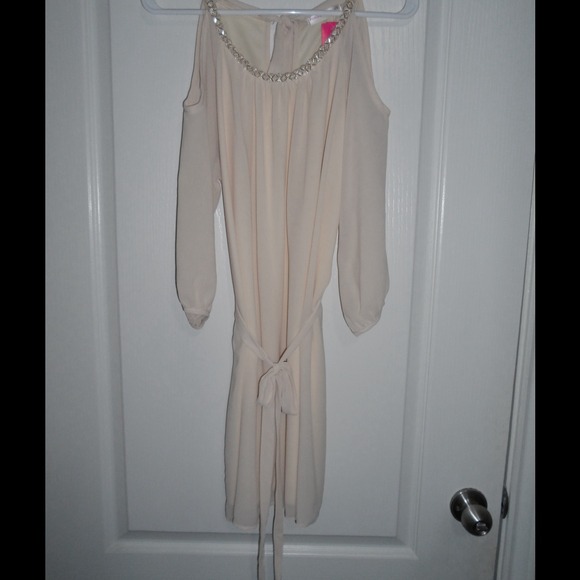 Sheer nude color off the shoulder dress.