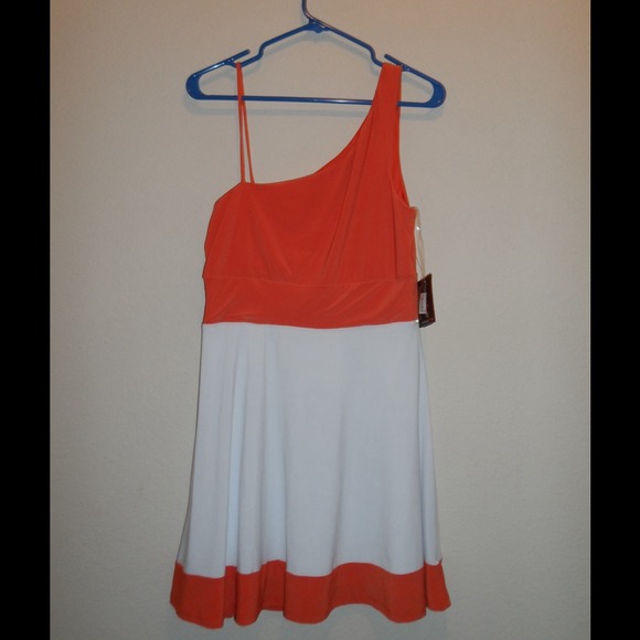 Orange and white one shoulder dress.