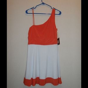 Orange and white one shoulder dress.