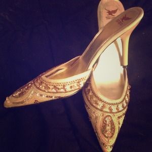 Gold pointy shoes