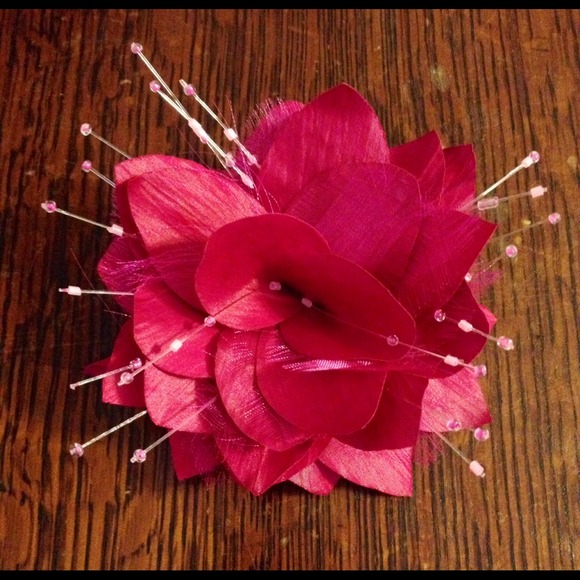 Hair or pin flower accessory.