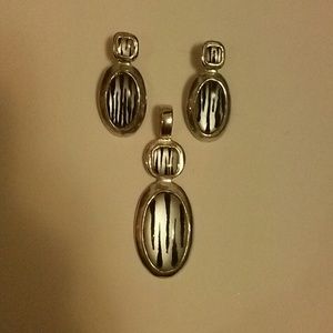 Silver pendant with matching earrings set.