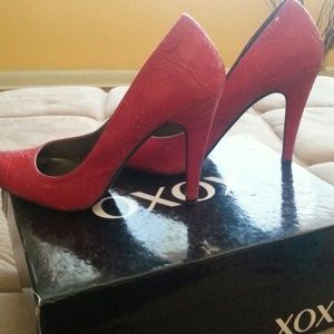 Red xoxo pumps