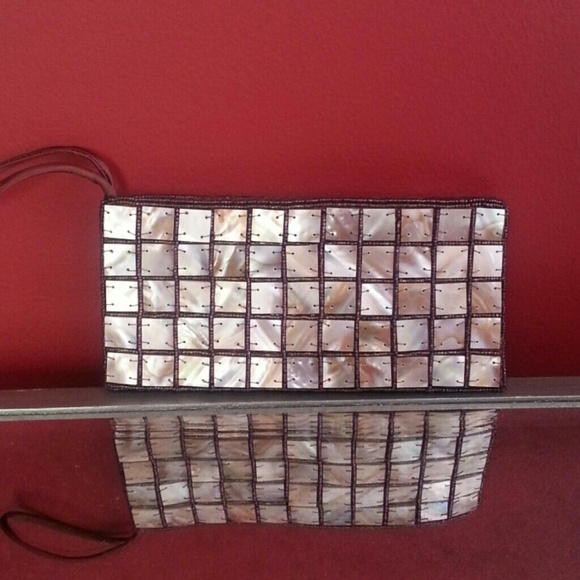 Clutch adorned in shells