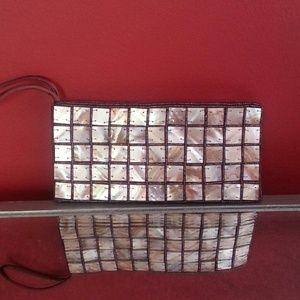 Clutch adorned in shells