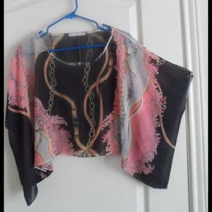 Sheer poncho wrap.