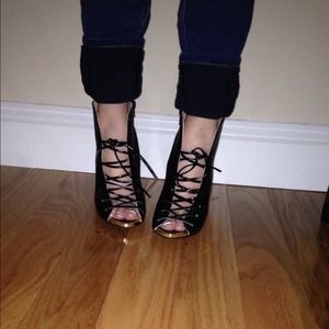 Never been worn lace-up peep toes. NWOT.