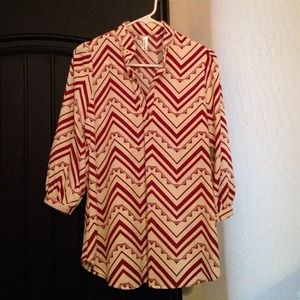 A burgundy and  white chevron style top,