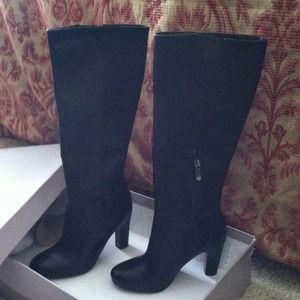 Black leather tall boots. Size 5; never been worn