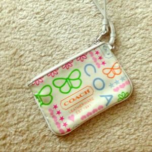 Coach wrislet. White and pink.