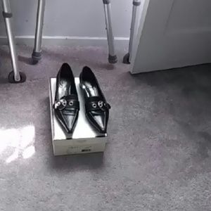 Black flat coach shoes