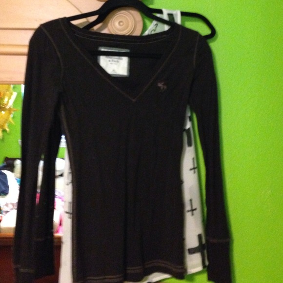 Long sleeve shirt has a small hole