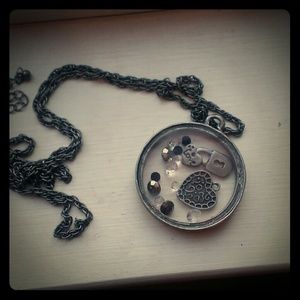 Long pendant necklace.