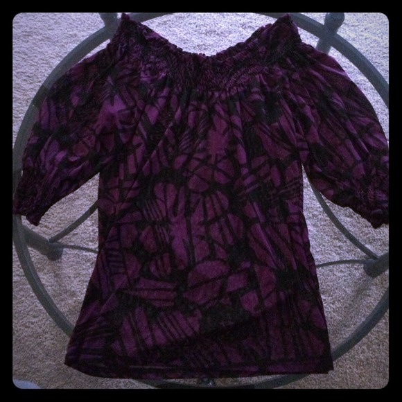 Purple/black off the shoulder shirt.