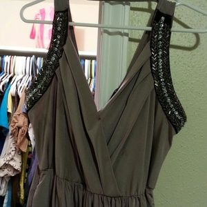 Gold dress with beading around arms