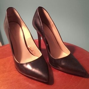 Black leather pumps