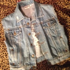 Light wash denim vest with back slightly destroyed