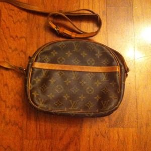 Cross-body bag great for travels. Vintage LV