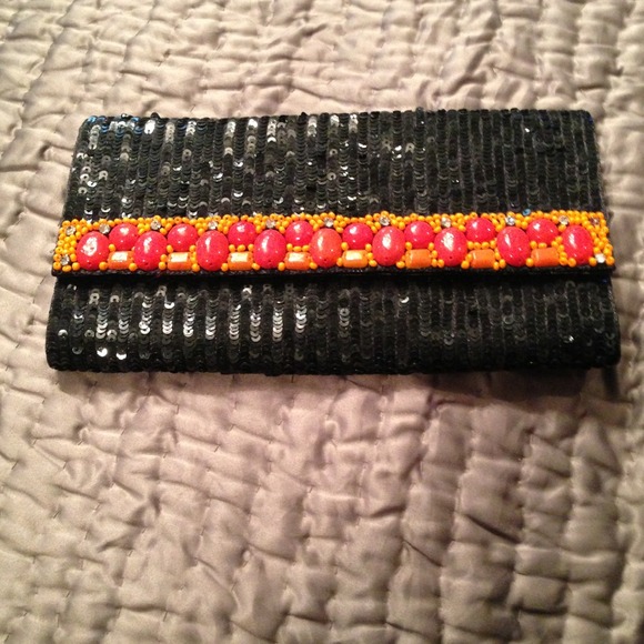 A black sparkly completely hand embroided clutch.
