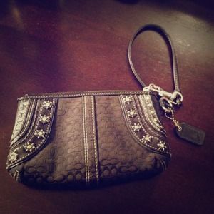 Black and silver coach wristlet