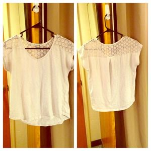 White t-shirt with knit pattern around shoulders