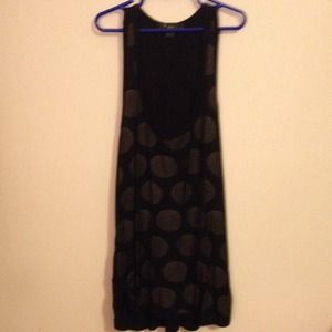 A black polka dotted tank top