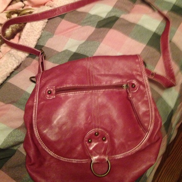 Pink leather purse over the shoulder strap