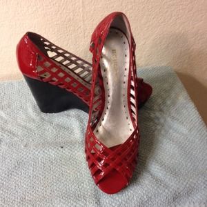 Beautiful caged red patent leather wedges!