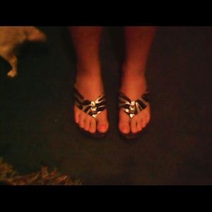 Zebra striped flip flops