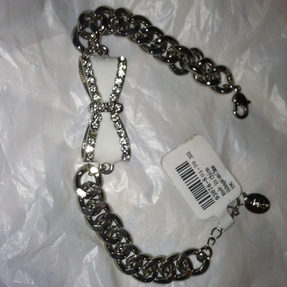 Silver and white bow with rhinestones bracelet.