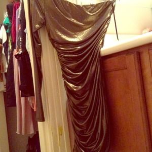 Gold metallic skin tight shoulder showing dress