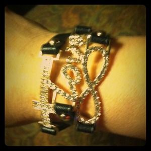 Black wrap cross/infiniti/love bracelet.