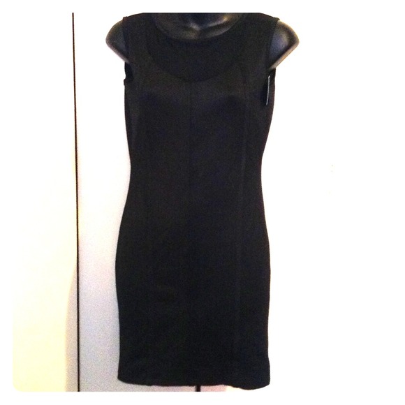 Dresses & Skirts - Black mini dress with see thru accent.