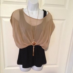 Black tanktop attached to tan top