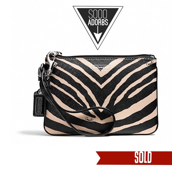 SOLD. Coach zebra print Wristlet