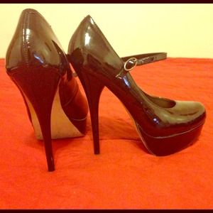 Black High Heel Pump with single ankle strap.