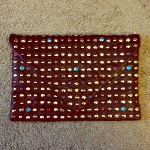 Jeweled black leather clutch