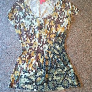 Mosaic knit top with peplum flair.